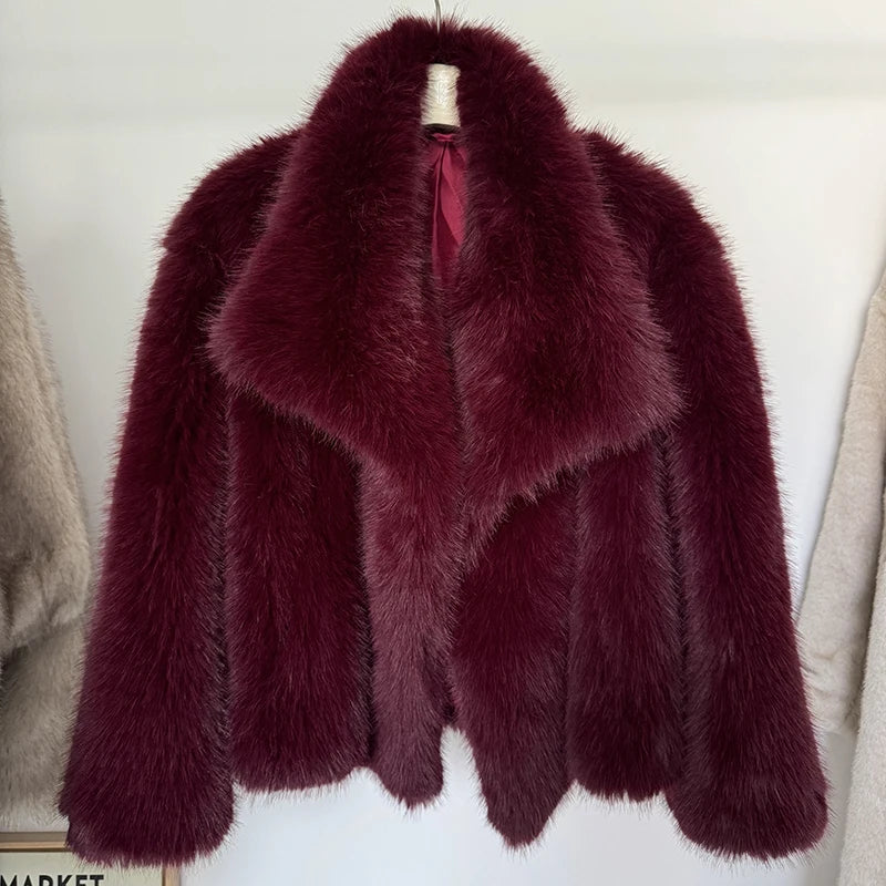 Luxurious gradient faux fur coat for women with a big fluffy collar. High-street winter fashion.