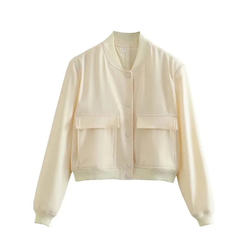 Stylish white bomber jacket for women with buttons, long sleeves, and a cropped design. Perfect for autumn and winter.