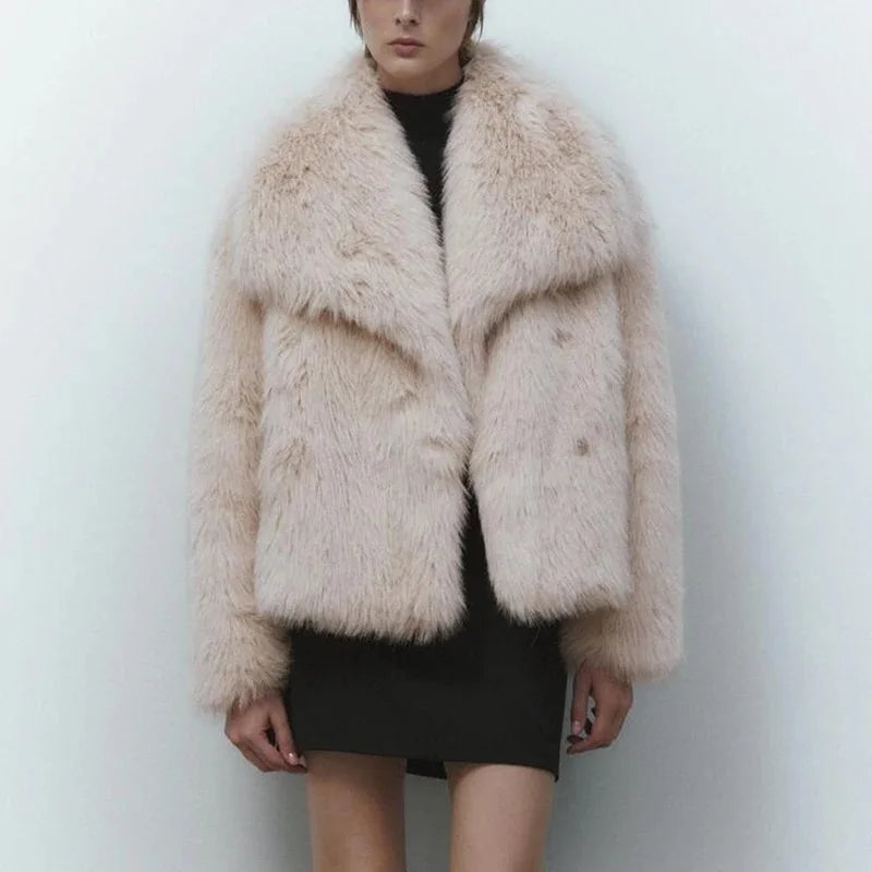 Luxurious gradient faux fur coat for women with a big fluffy collar. High-street winter fashion.