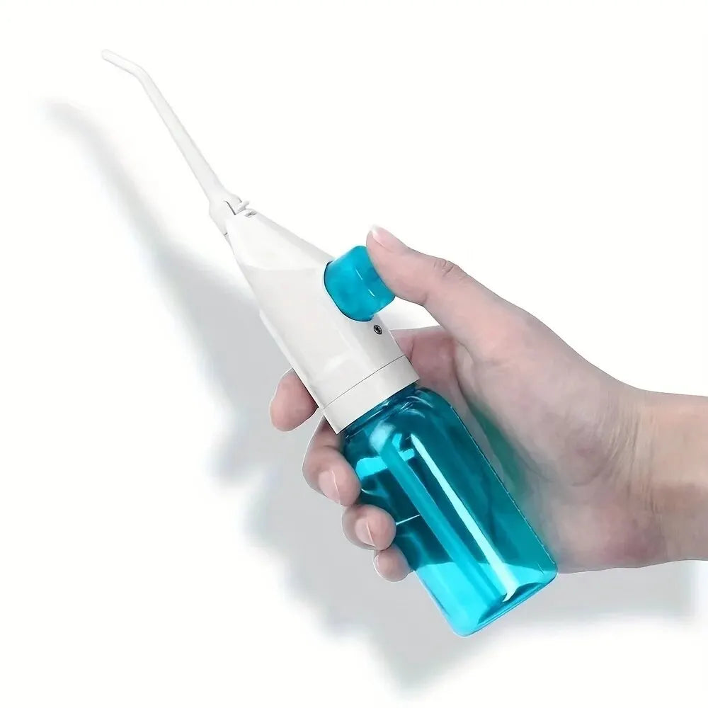 Portable high-pressure oral irrigator for teeth cleaning, manual water floss, and dental water pick