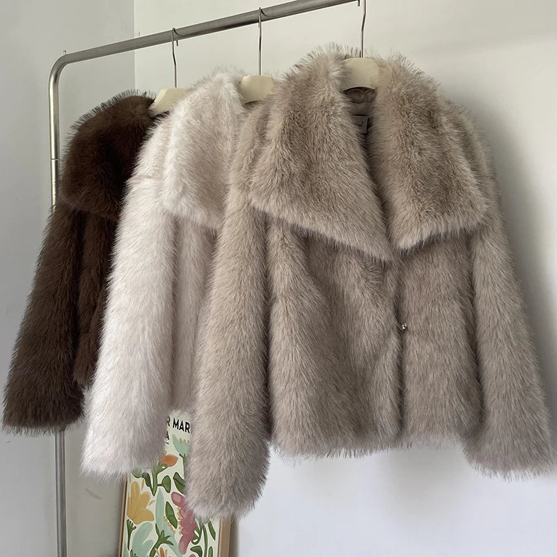 Luxurious gradient faux fur coat for women with a big fluffy collar. High-street winter fashion.