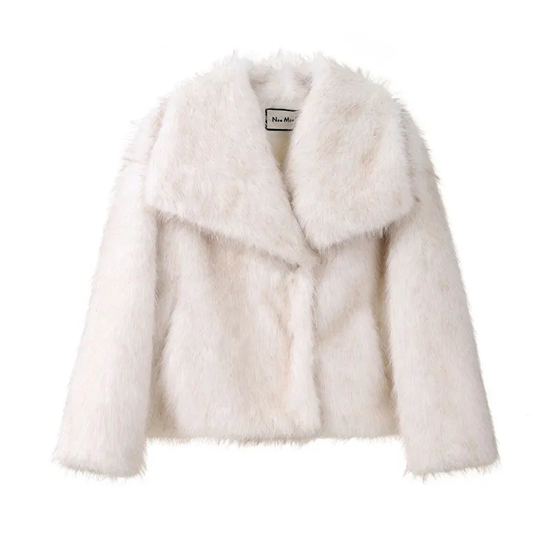 Luxurious gradient faux fur coat for women with a big fluffy collar. High-street winter fashion.