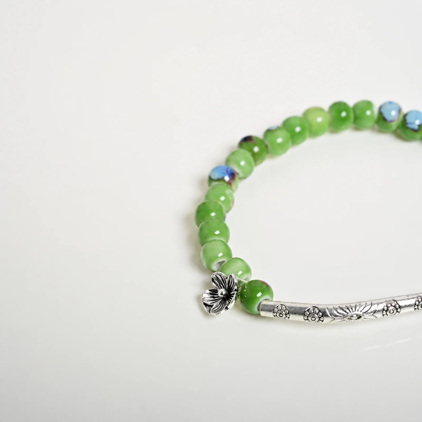 Handmade Green Ceramic Flower Bead Bracelet – Braided Elastic Cord Artisan Jewelry