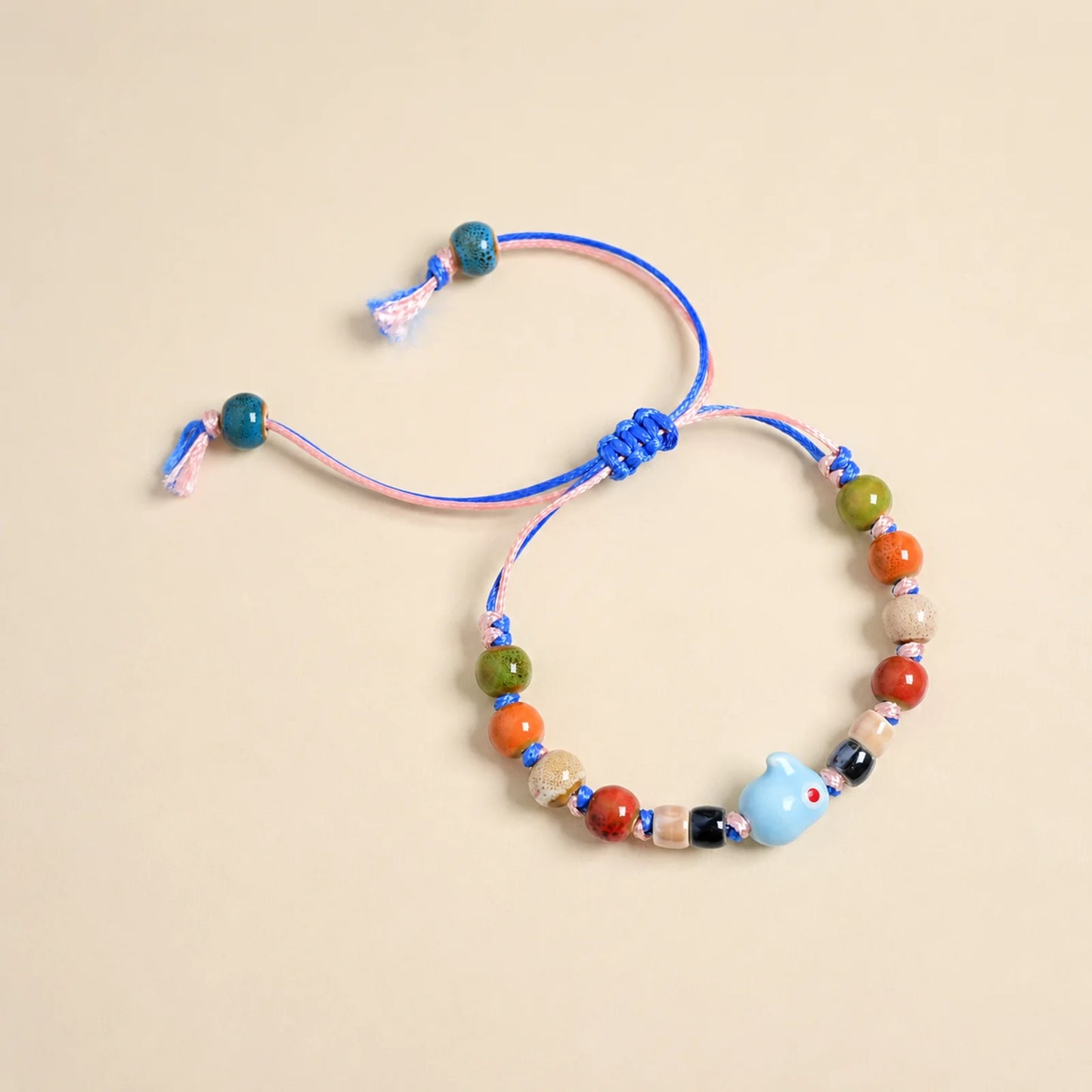 Handmade Blue Rabbit Ceramic Bracelet – Adjustable Woven Wax Cord Bunny Charm Jewelry