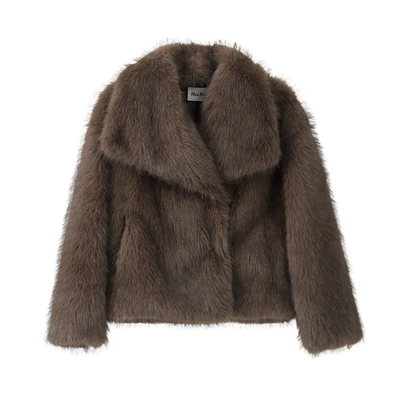 Luxurious gradient faux fur coat for women with a big fluffy collar. High-street winter fashion.
